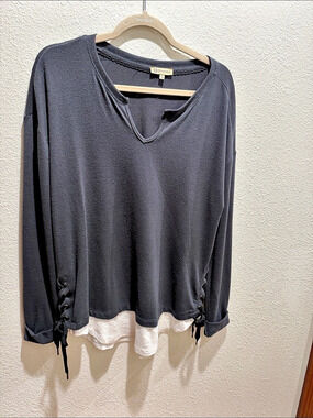 Layered Hem Long Sleeve Top in Black and White hem with side side lace ups.